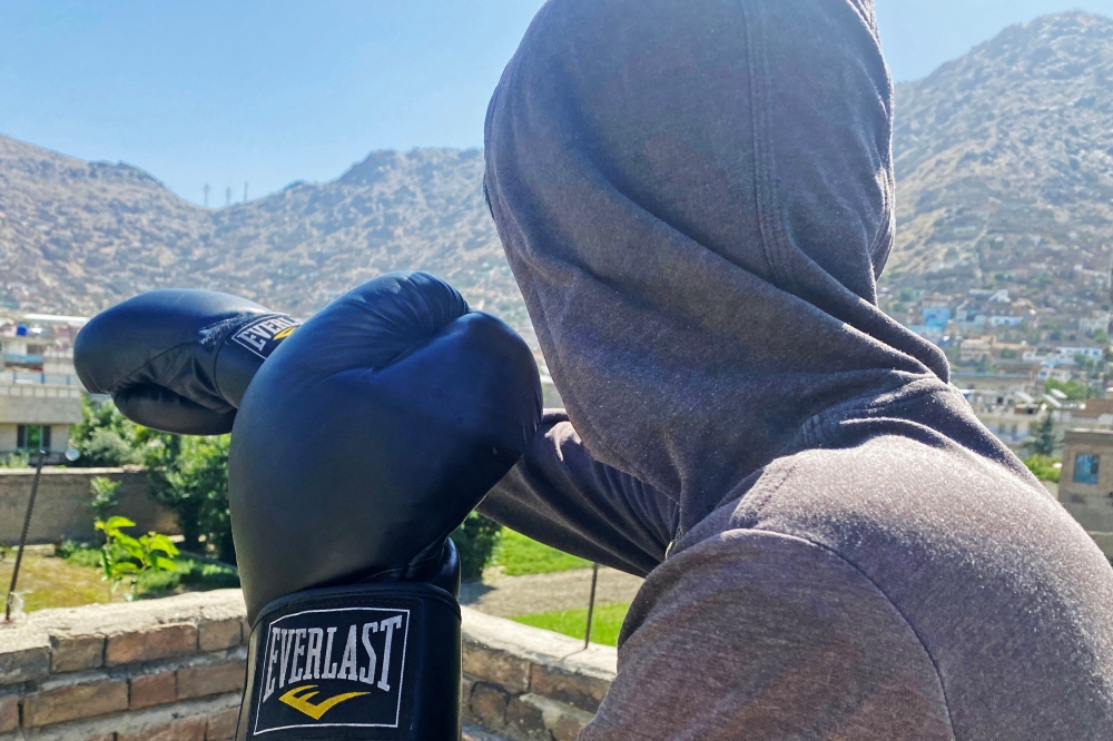 Afghan women train in secret, not for competition, but for a little health and peace of mind in a country where the Taliban government has stopped women from playing sports. - AFP image 